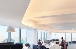 Custom open office stations maximize the spaces spectacular views and enhance the architectural details. thumbnail